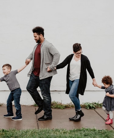 family walking, holding hands